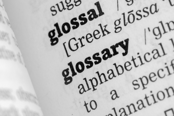 Close-up of the word "glossary" in a dictionary.